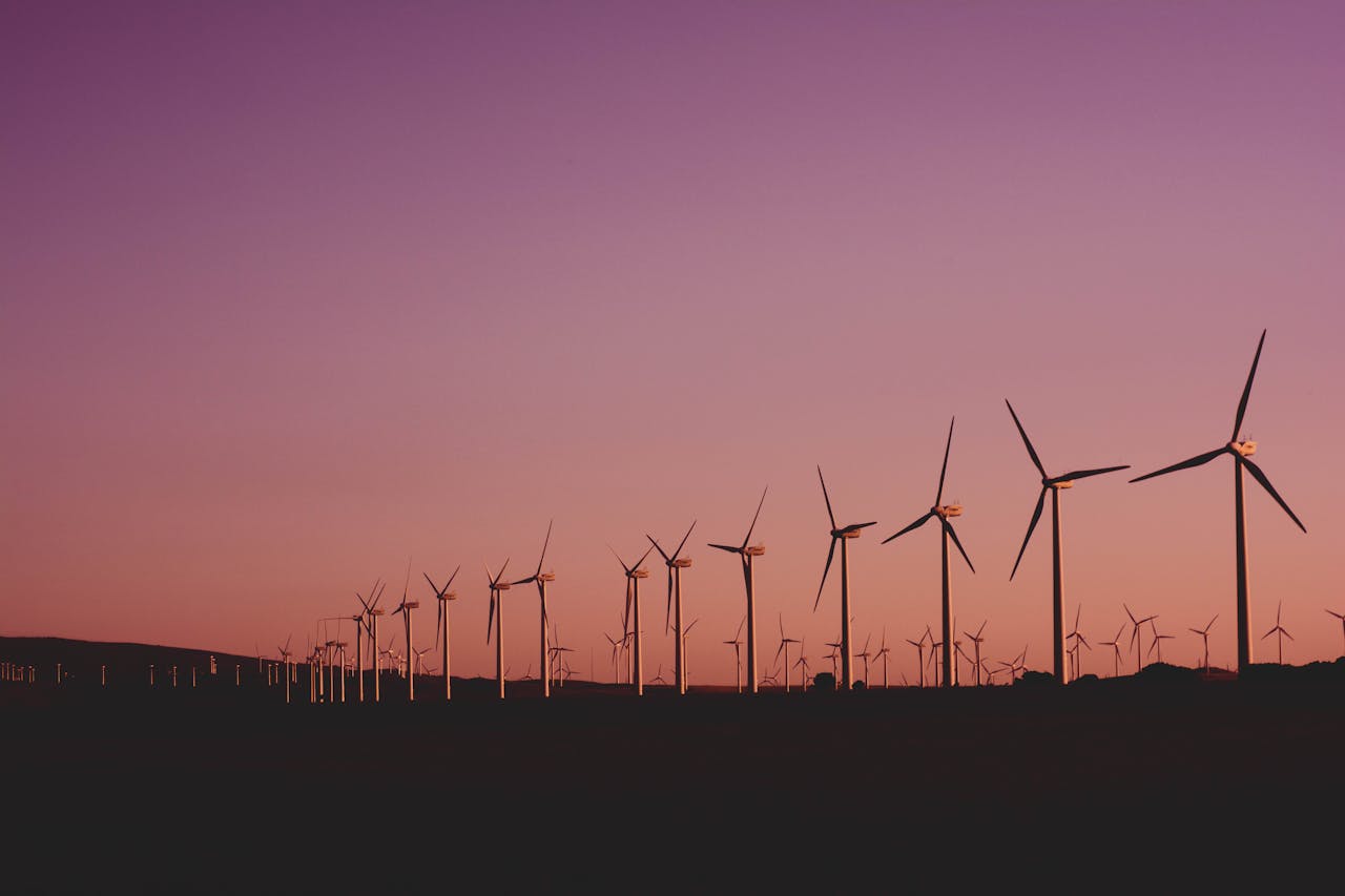 about-01 Silhouetted wind turbines at sunset in Zahara de los Atunes, Spain.
